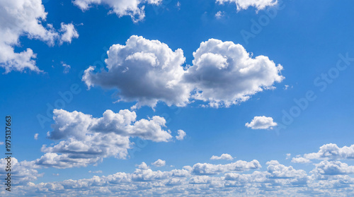Slika na platnu A bright blue sky with numerous white puffy clouds scattered across it on a sunn