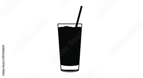 A tall glass of dark liquid with a straw black silhouette