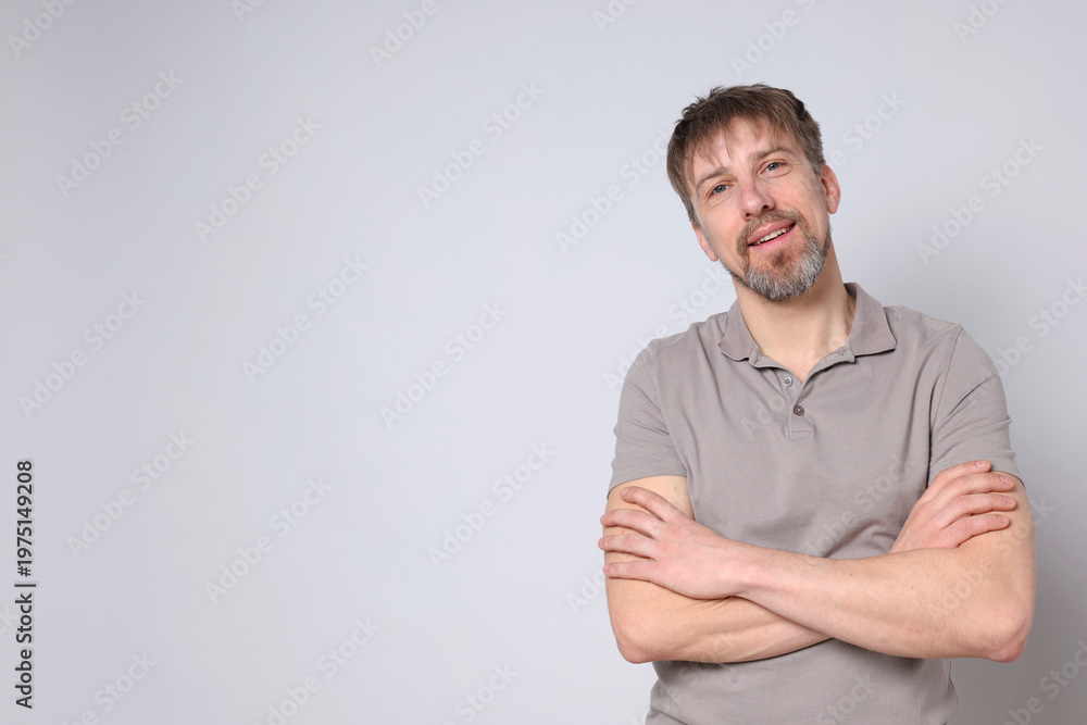 Fototapeta premium Portrait of handsome man on white background, space for text