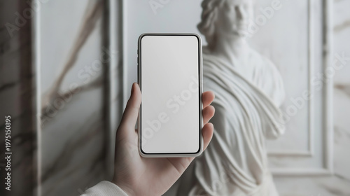 Female hand holding smartphone with blank screen in front of marble statue