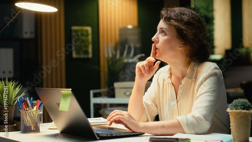 Vászonkép Genius businesswoman making a breakthrough discovery late at night, having a spark of the moment with a new innovative idea