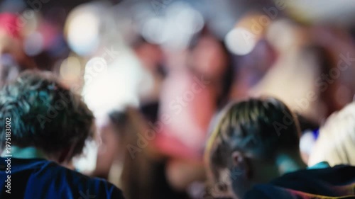 Behind scenes during preshow. Audience shadows with crew preparing for show