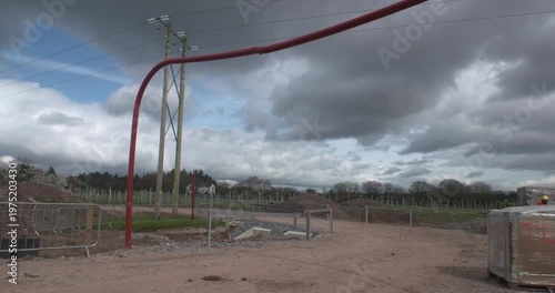 Height restriction barrier near overhead electricity power lines construction site safety