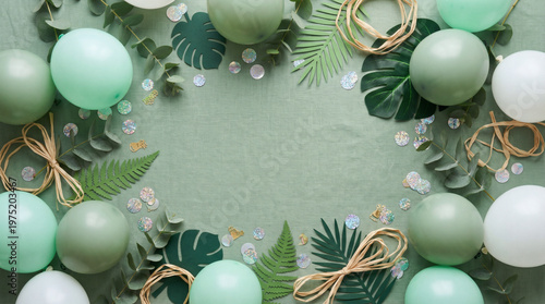 Fresh Festive Party Background with Mint Green and Sage Balloons on Eucalyptus Green with Tropical Palm Leaves, Flat Lay with Copy Space