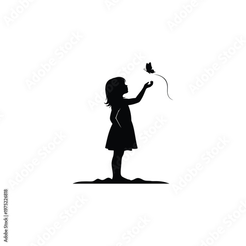 A little girl is releasing a butterfly into the air outdoors.