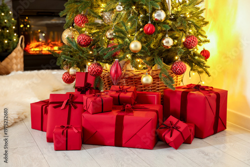 Many gift boxes under Christmas tree indoors