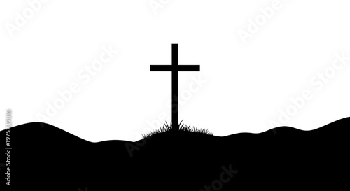 Silhouette of a Christian cross on a grassy hill top