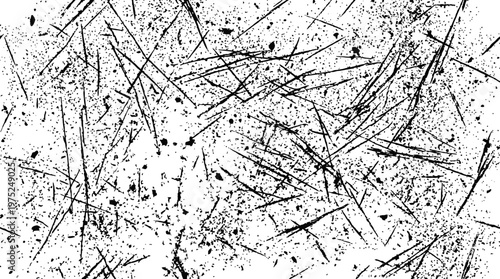 Abstract black scratch lines scattered across a white surface creating dynamic texture and pattern.