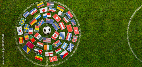 Foto Soccer ball surrounded by international flags arranged in a circle on green grass field