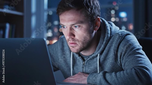 Developer Working on Laptop at Night