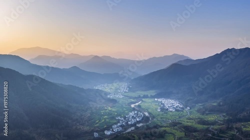Wallpaper Mural Aerial time-lapse at dawn of rapeseed flower terraces and Huizhou-style villages, Jiangling, Wuyuan county, Jiangxi province, China. Torontodigital.ca