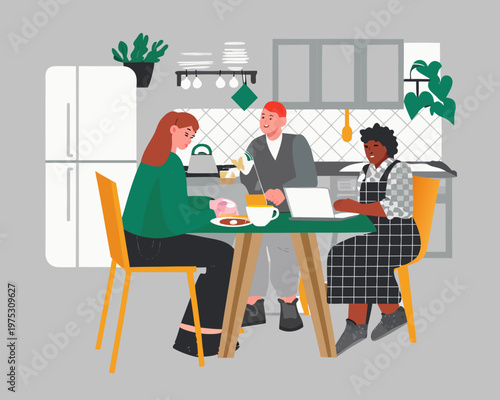 People having breakfast and working on a laptop in a modern kitchen