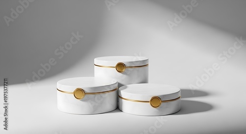 Marble jewelry boxes sit on a white surface with soft side lighting.