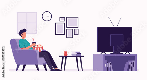 Relaxed man sitting in an armchair watching television while eating popcorn and drinking soda in his cozy living room.