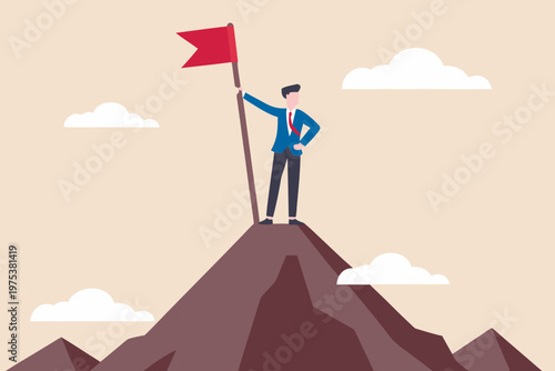 A businessman celebrates success atop a mountain peak with a red flag