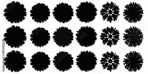 Collection of black ink blots resembling trees or floral shapes