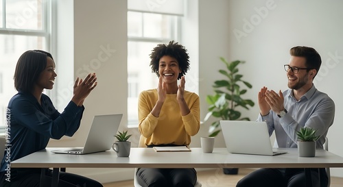 Diverse Team Applauding Success in Modern Office Setting.