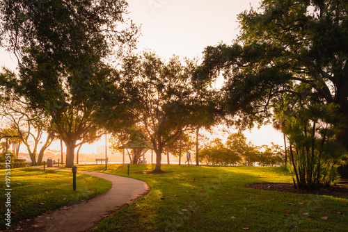 Walkers in Landings Park, Naples, Florida at sunrise