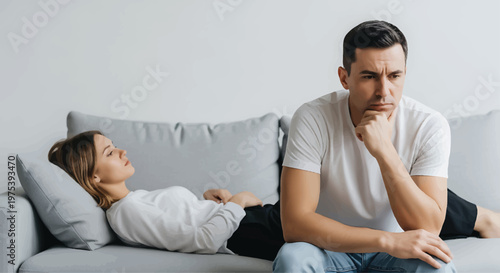 Unhappy Man and Woman on Sofa