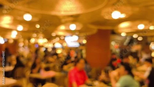 Blurred people' activities in food court.