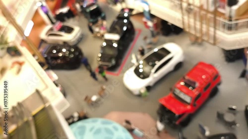 Blurred and unfocused motor vehicle exhibition interior designed as a soft background.