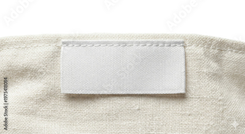 Fotografie Blank white fabric clothing label sewn on canvas material