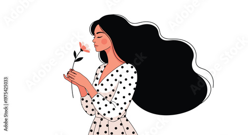 Beautiful woman with long flowing dark hair wearing a polka dot dress while smelling a delicate spring flower in profile view.