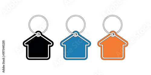 Fotografija Three house shaped keychains black blue orange on white background