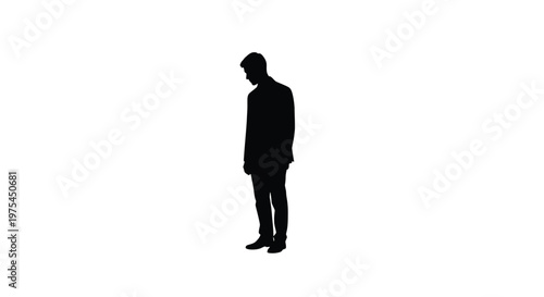 Silhouette of a man in a suit standing and looking down