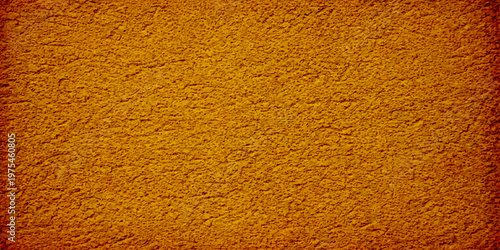 Rough orange and yellow textured wall surface with a grunge paint pattern and old material design