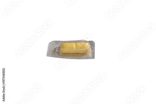 Single yellow medicine pill in clear blister pack isolated on png background, pharmaceutical drug for health.