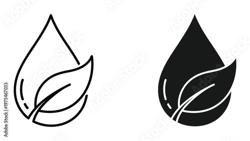 A person in a green shirt holding a cup of coffee and sitting at a table with a laptop in a cozy workspace filled with natural light