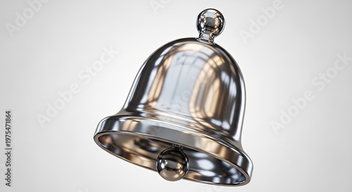 A shiny silver bell with a reflective surface against a plain background
