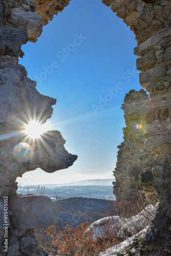 A dramatic view through the weathered stone ruins of Belecgrad fortress