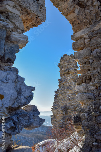 A dramatic view through the weathered stone ruins of Belecgrad fortress