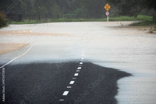 Flooded rural road after heavy rain in Northland New Zealand