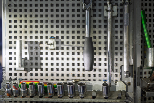 Slika na platnu Neatly Organized Sockets and Wrenches on Tool Wall