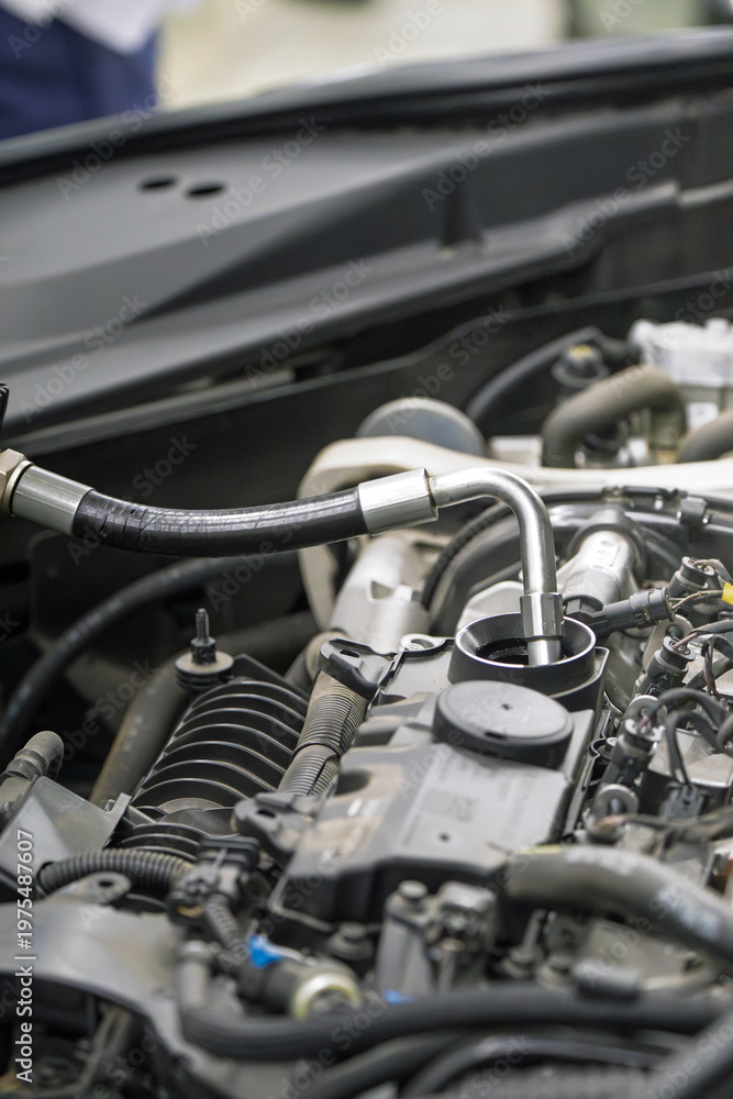 Obraz premium Adding Engine Oil Inside Car Engine Bay