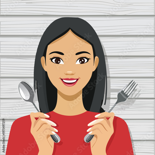 Woman holding spoon and fork smiling against wood background