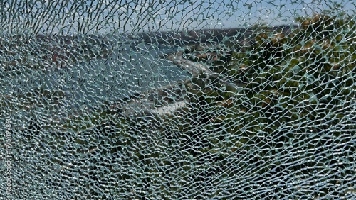 Shattered tempered glass window texture background, broken safety glass pattern background.