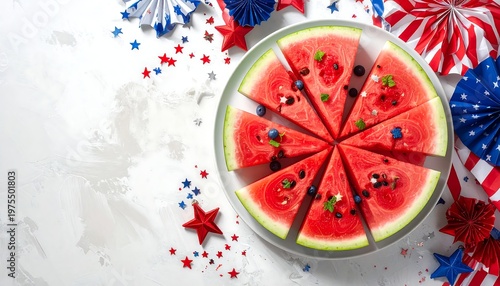 A sliced watermelon with festive decorations on a white surface