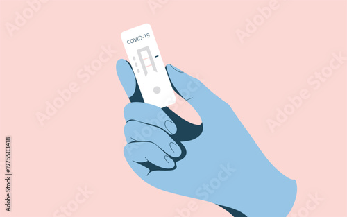 Hand in blue glove holding a positive covid-19 rapid antigen test