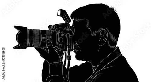 Man holding video camera to face.