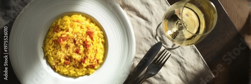 Golden saffron risotto plated for a sophisticated meal, showcasing traditional italian food, ready for dining