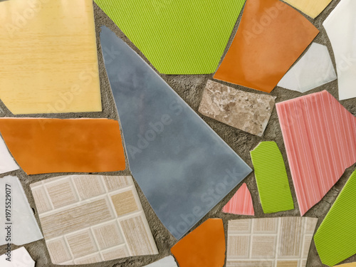 Vibrant Mosaic Artwork Displaying Assemblage of Colored Tiles. Array of brightly colored and textured tiles arranged in captivating mosaic pattern. Full frame. Close-up. Copy space