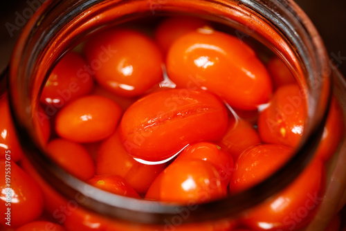 A jar of red tomatoes