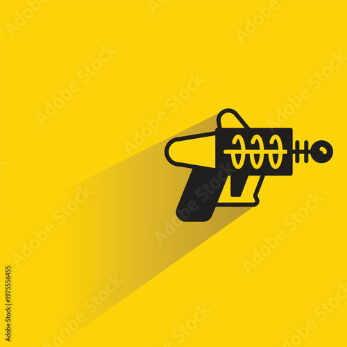 ray gun icon with shadow on yellow background