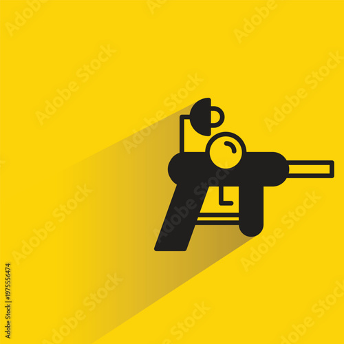 ray gun icon with shadow on yellow background