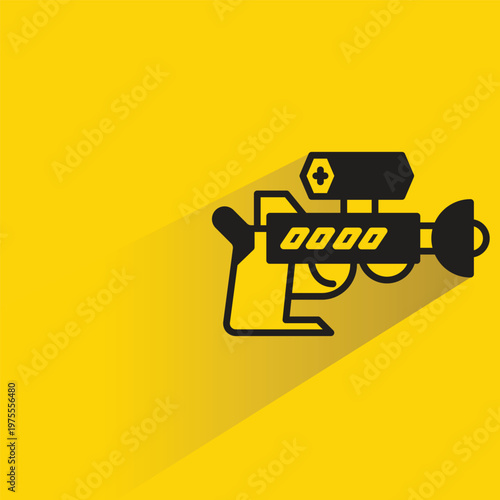 space gun icon with shadow on yellow background
