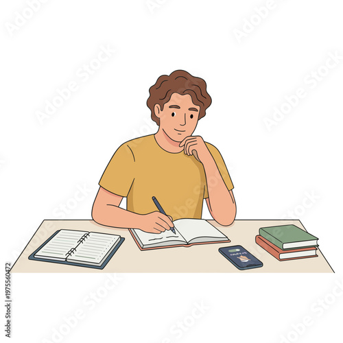 Man sitting at desk writing in notebook with books and phone nearby